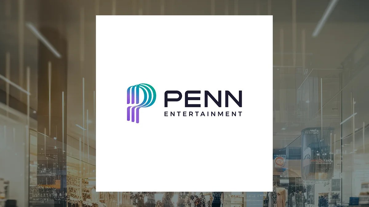 Penn Entertainment logo displayed on white square against indoor office space with glass walls. Penn Entertainment logo displayed on white square against indoor office space with glass walls.