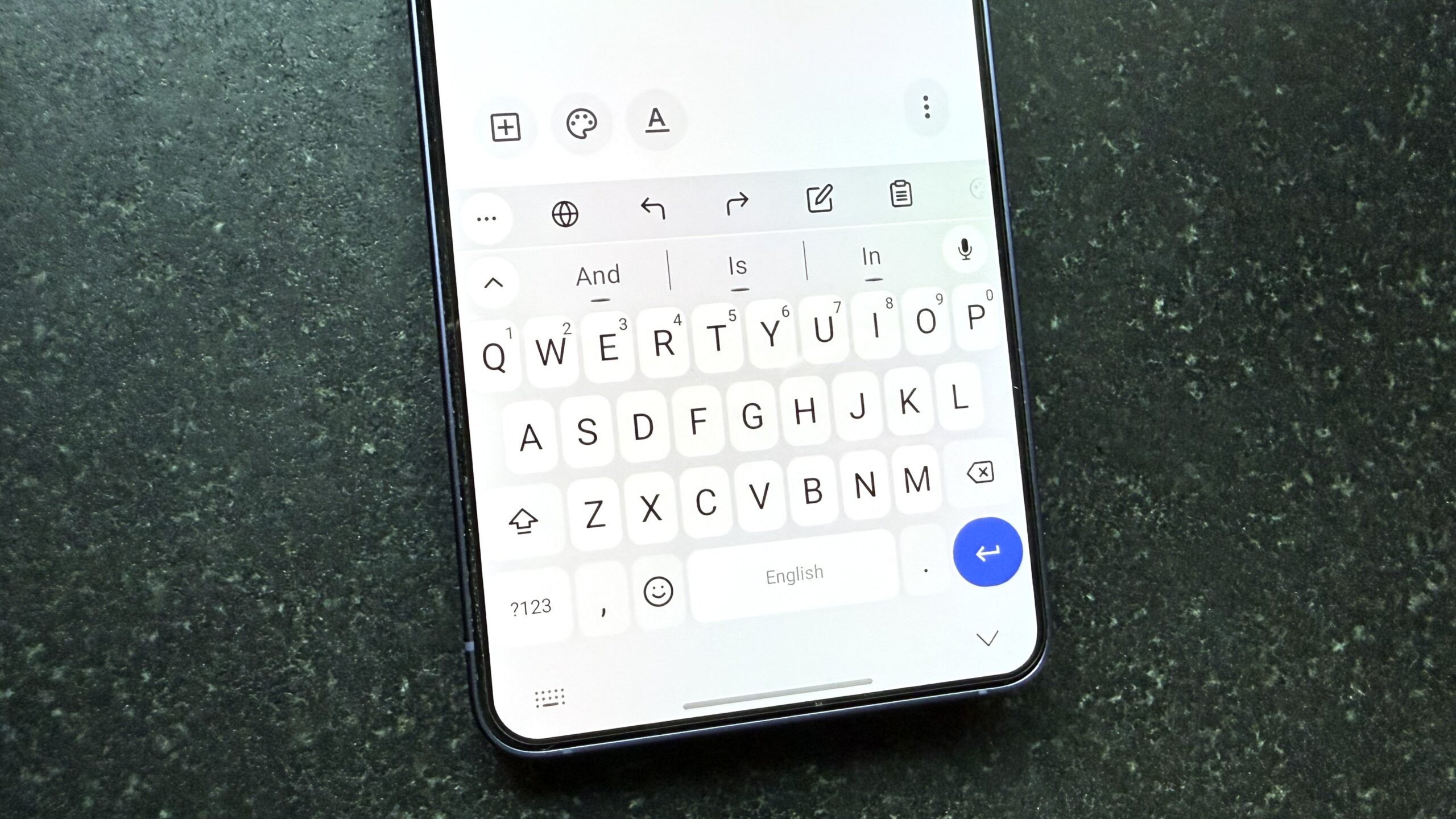 Smartphone displays an open note-taking app with active keyboard on a textured background with numbers. Smartphone displays an open note-taking app with active keyboard on a textured background with numbers.