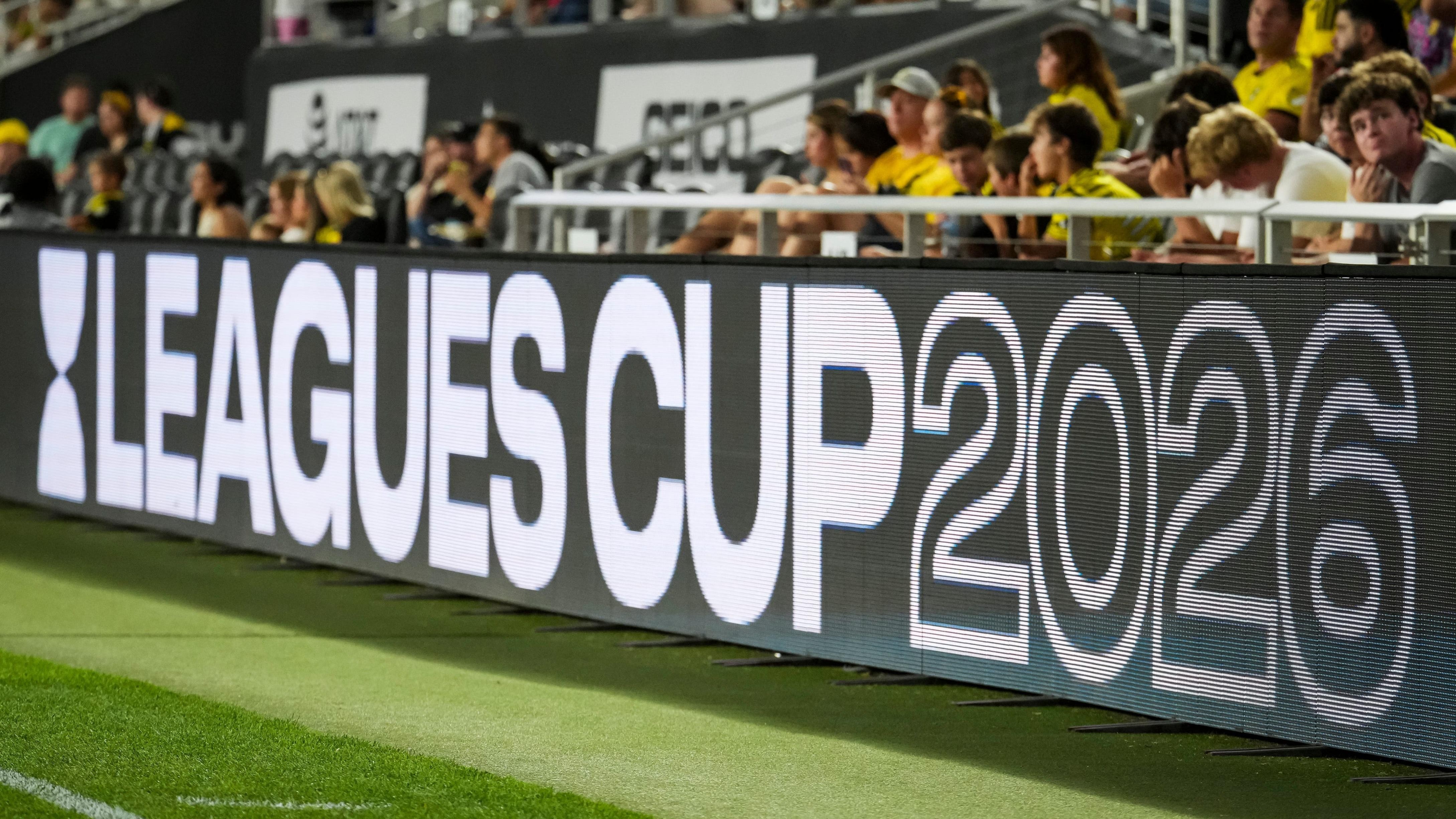 A "LEAGUES CUP 2023" digital display shows the event name at a soccer stadium with spectators visible.