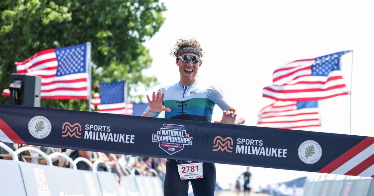 Athlete crosses finish line at Sports Milwaukee National Championships 2025 with American flags visible. Athlete crosses finish line at Sports Milwaukee National Championships 2025 with American flags visible.