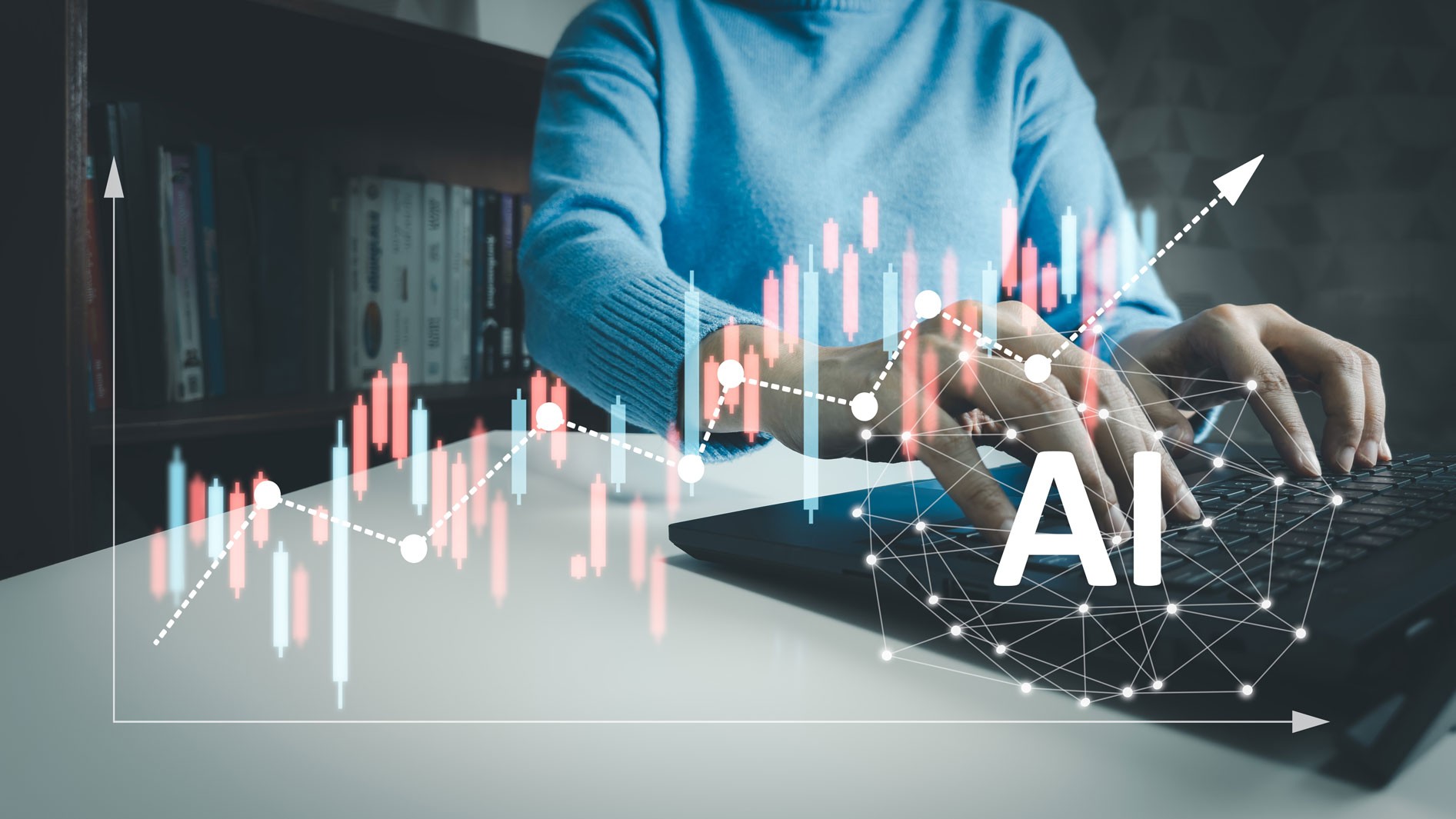 A person types on a laptop in an office, using AI to analyze stock market charts.