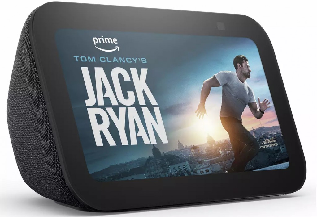 Amazon Echo Show displays "Tom Clancy's Jack Ryan" on its screen with a runner against a cityscape. Amazon Echo Show displays "Tom Clancy's Jack Ryan" on its screen with a runner against a cityscape.